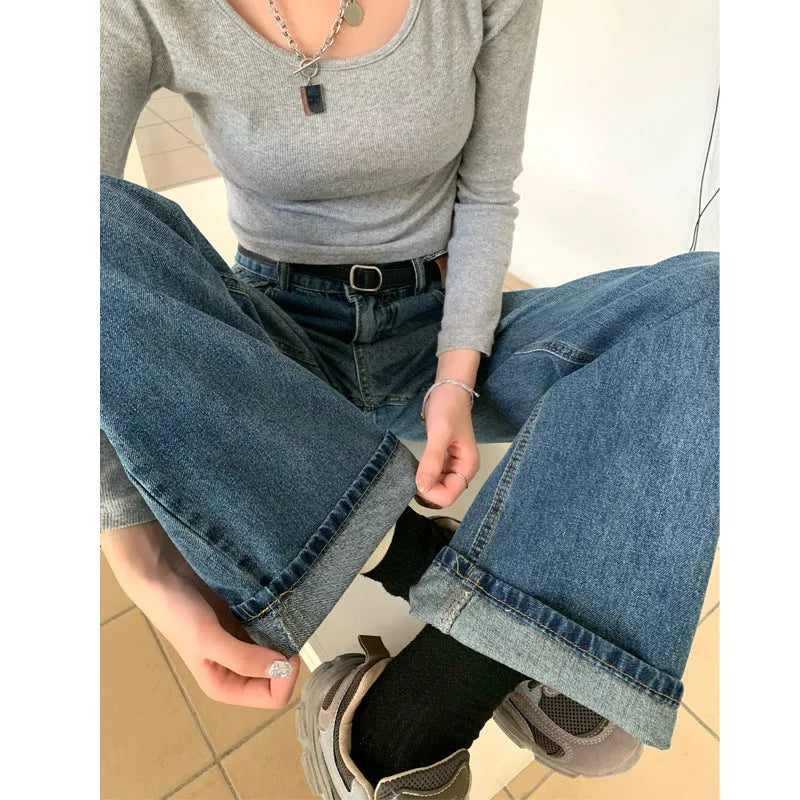 Women's high-waist retro blue straight-leg jeans on a model, showing the cropped, standard, and lengthened leg options.