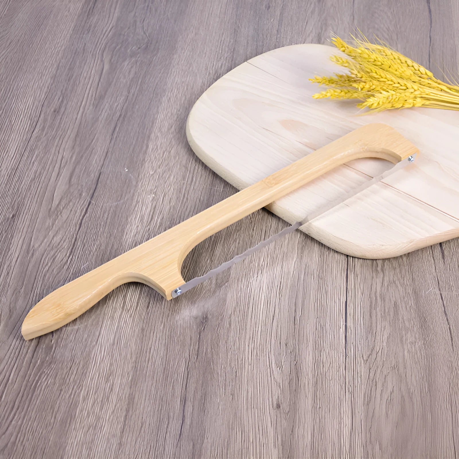 Wooden serrated bread knife 40cm with bending-resistant blade, wooden handle, shown slicing a wholemeal loaf