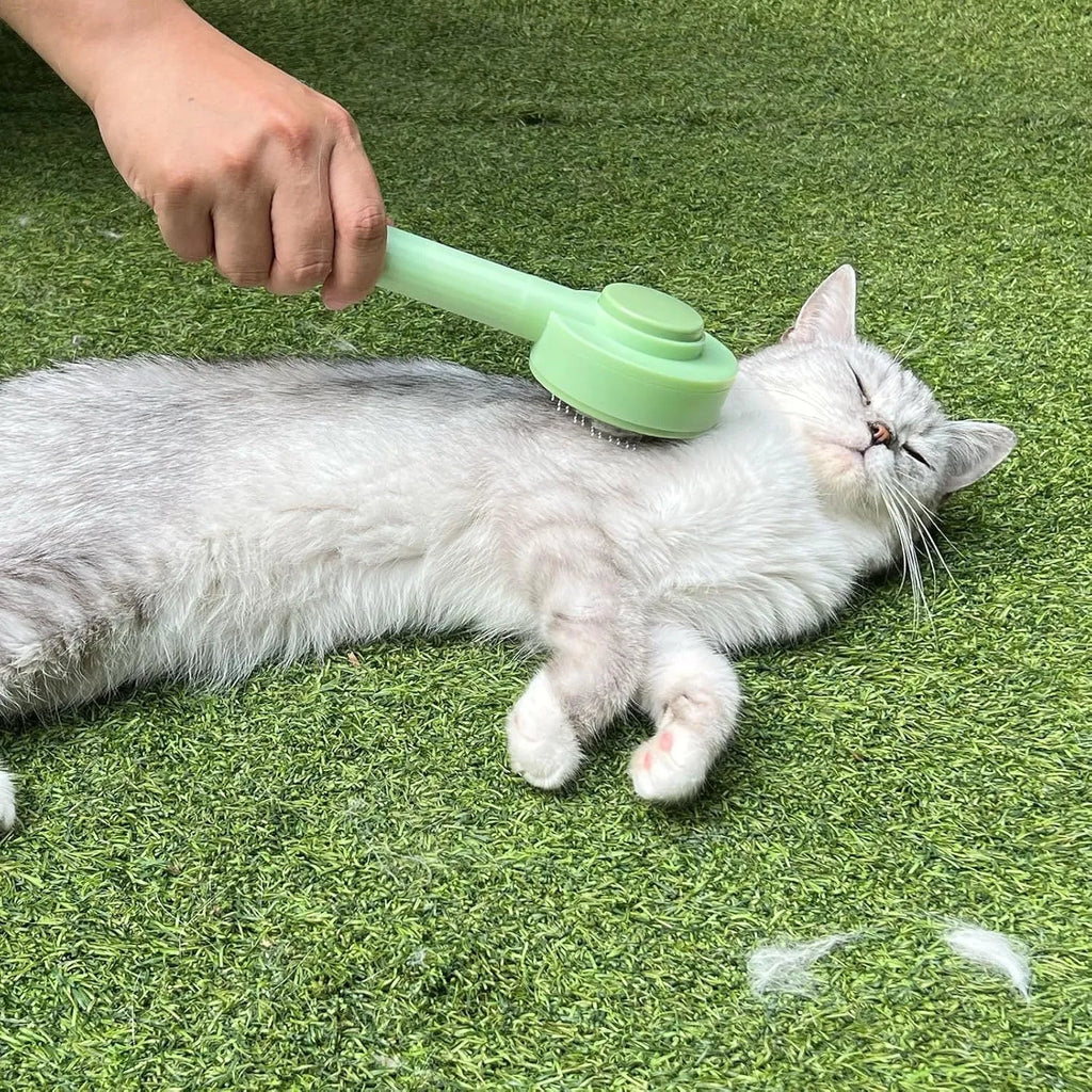 Green and yellow pet deshedding brush with stainless steel teeth and hanging loop