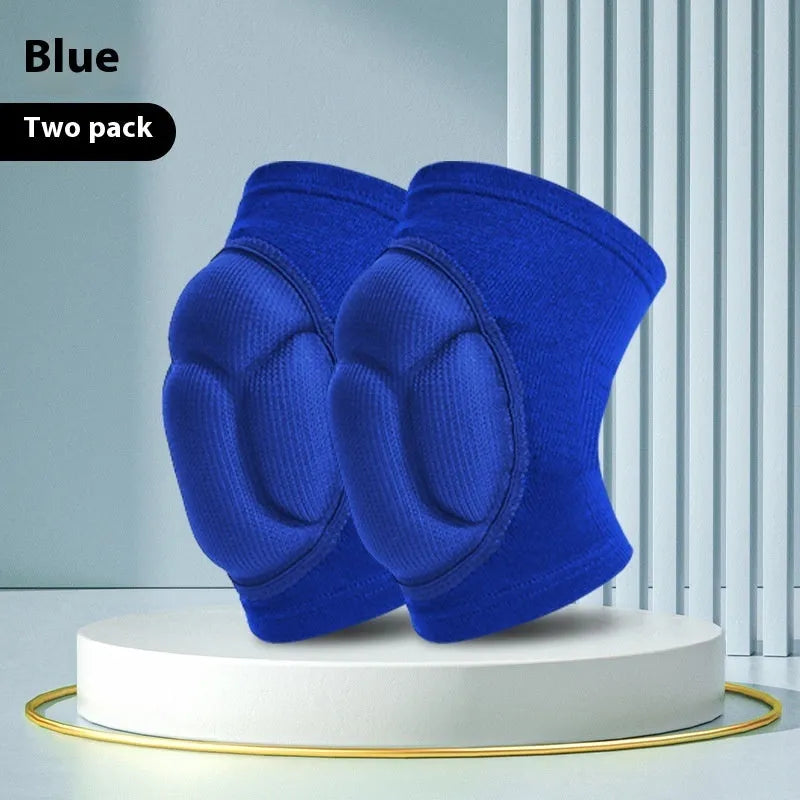 A pair of black thick sponge kneepads for dance and sports protection on a neutral background.