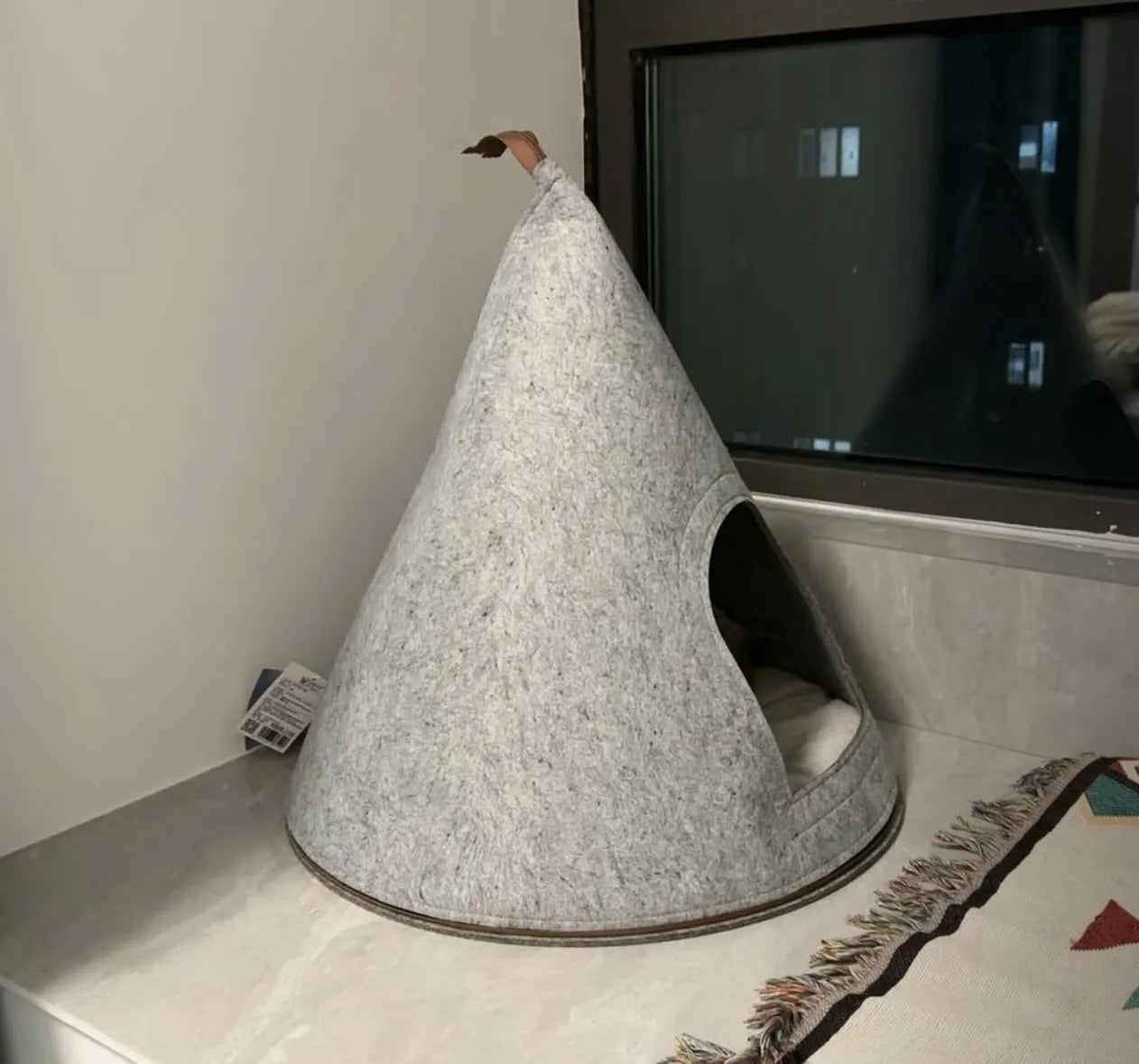 Grey handmade felt cone cat house measuring 50cm diameter by 51cm height