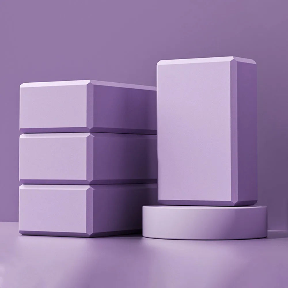 Blue high-density EVA yoga block with hexagonal sides and cut ridges for grip