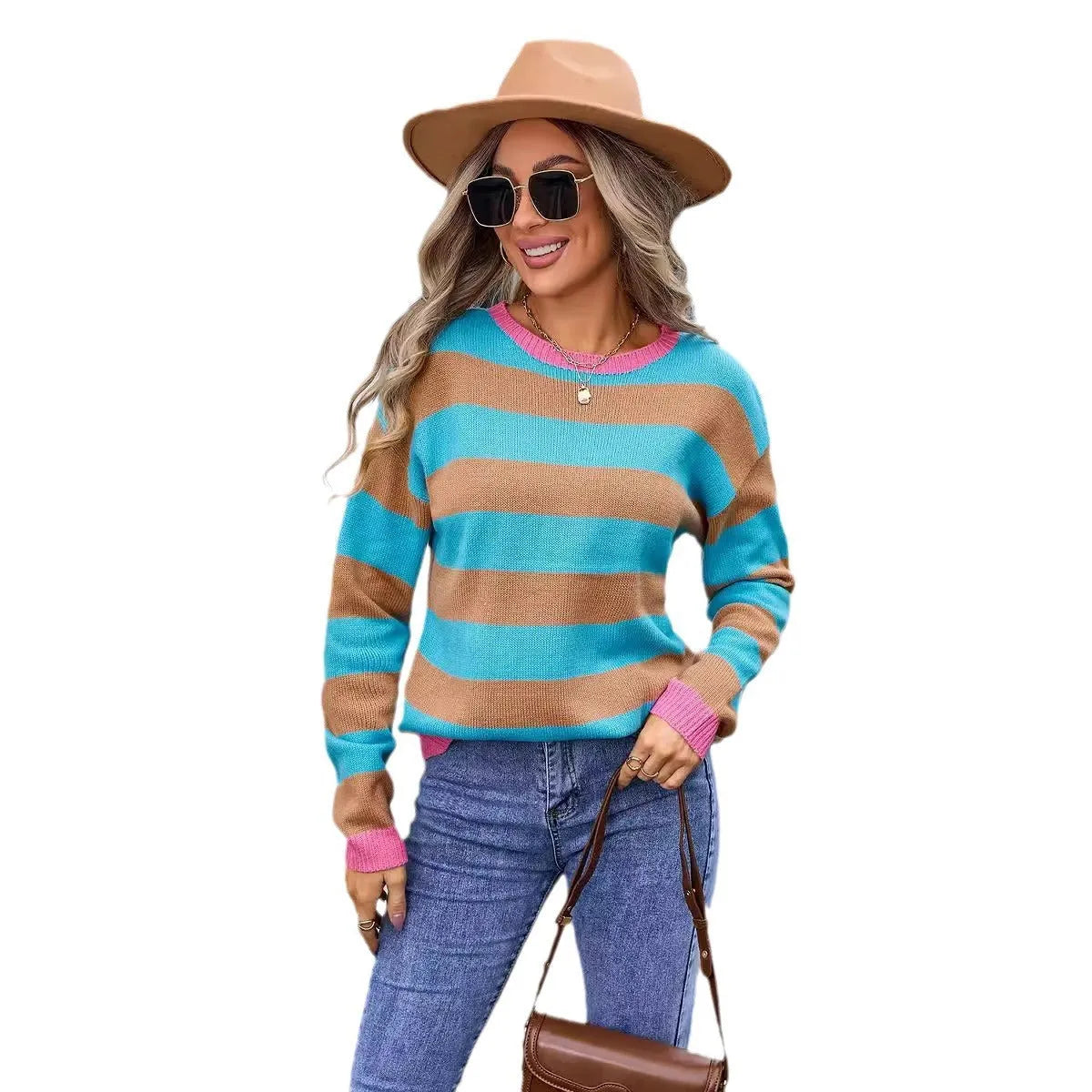 Women's loose blue striped acrylic knit sweater with long sleeves on a hanger.