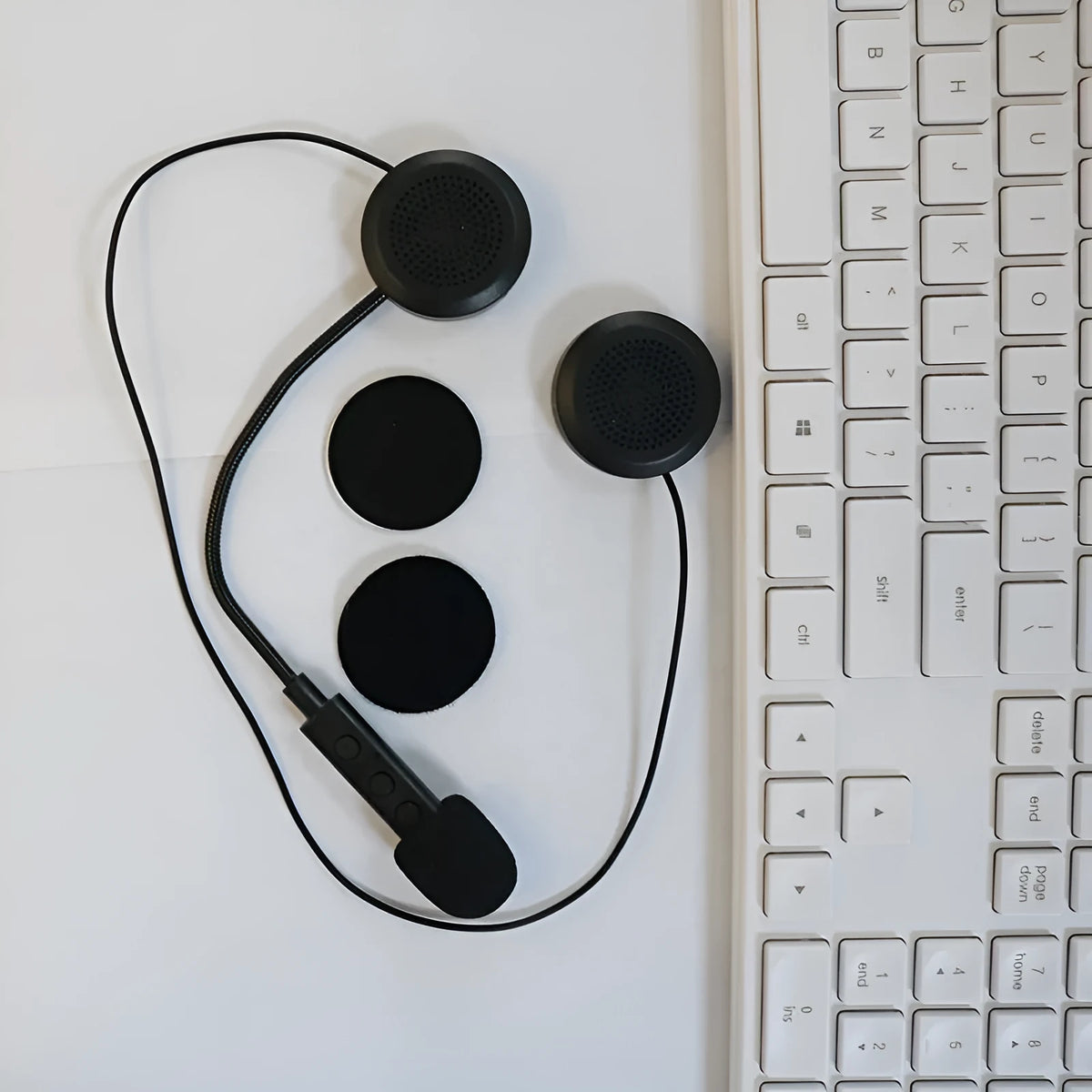 Black motorcycle helmet Bluetooth headset with large volume stereo and waterproof design on a dark background
