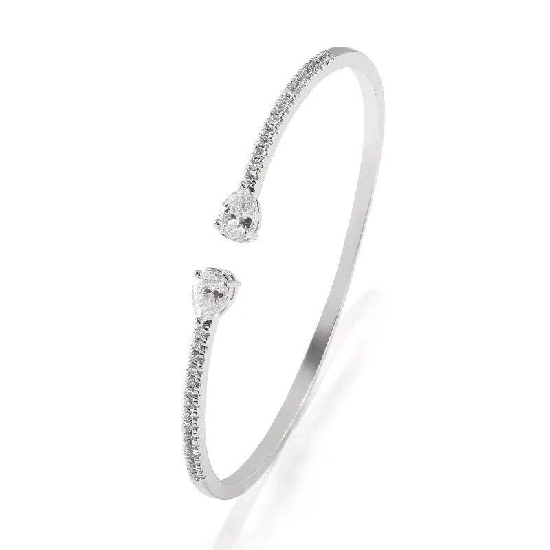 Copper multi-zircon bracelet with simple style in white colour option showing inlaid zircon treatment