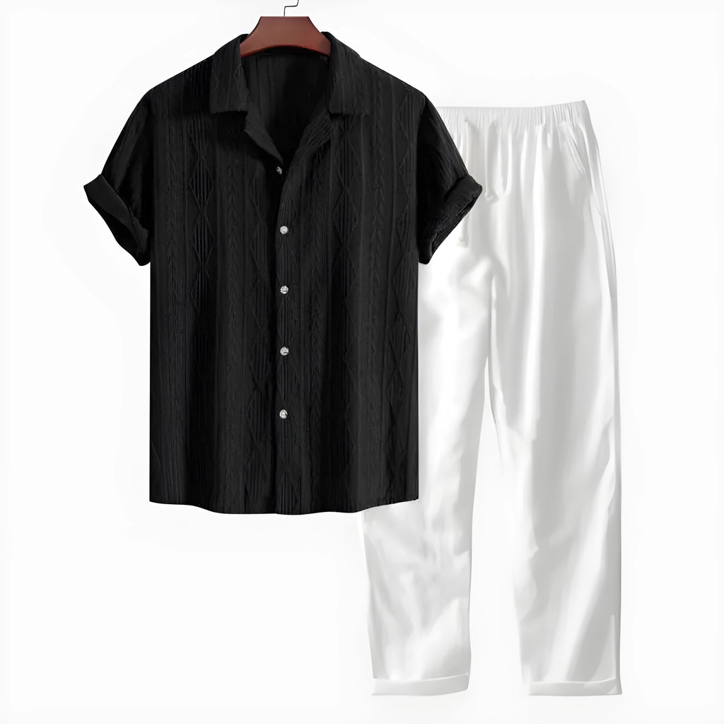 Casual linen suit set with camouflage print, featuring a short-sleeved top and matching trousers.