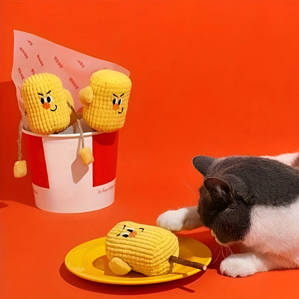 Polio wood corn cob shaped cat chew toy for dental health on a white background.