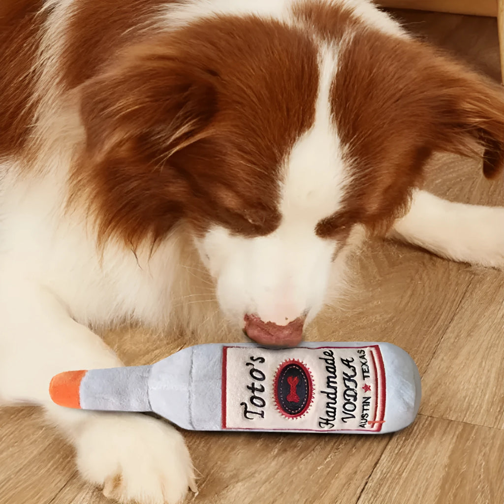 Brown plush dog toy shaped like a wine bottle with a textured surface.