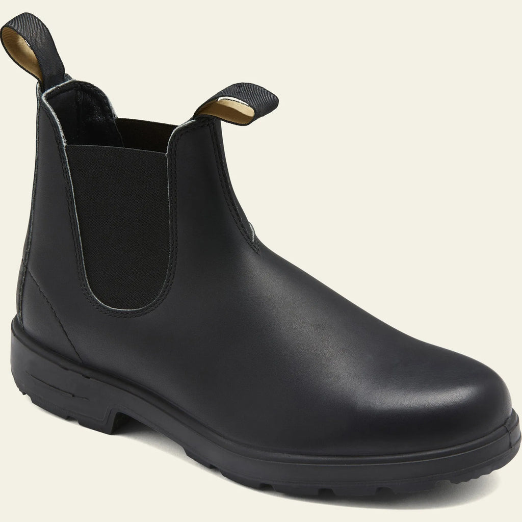 Vintage brown unisex Chelsea boots with car stitching and a low horse hoof heel.