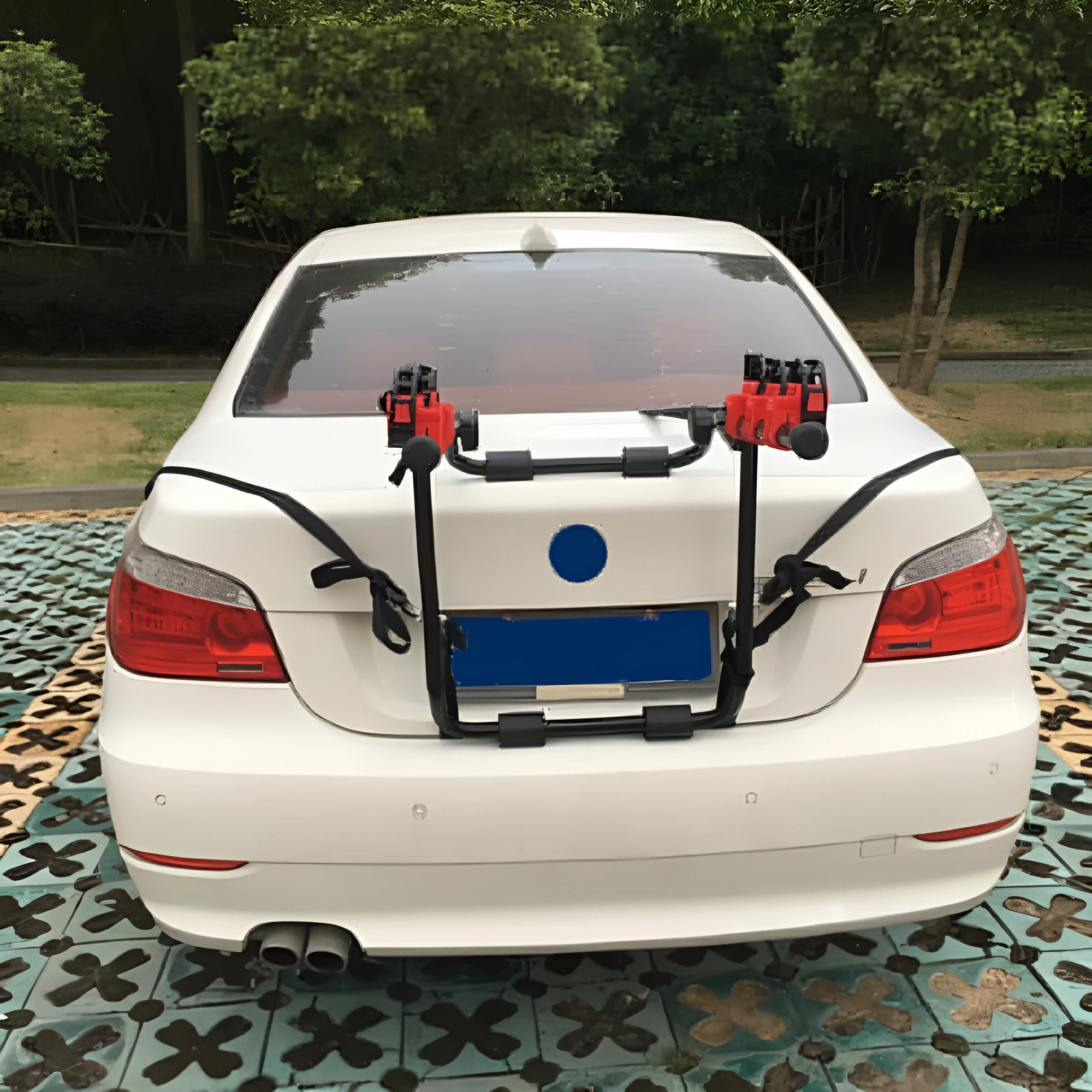 Black and red trunk-mounted bike rack showing pull belt and tie rope style options.