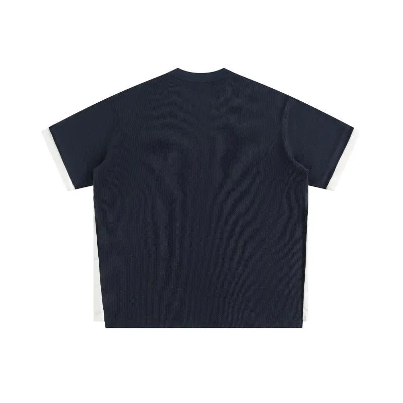 Retro loose waffle short-sleeved t-shirt with embroidered alphabet design in navy blue.