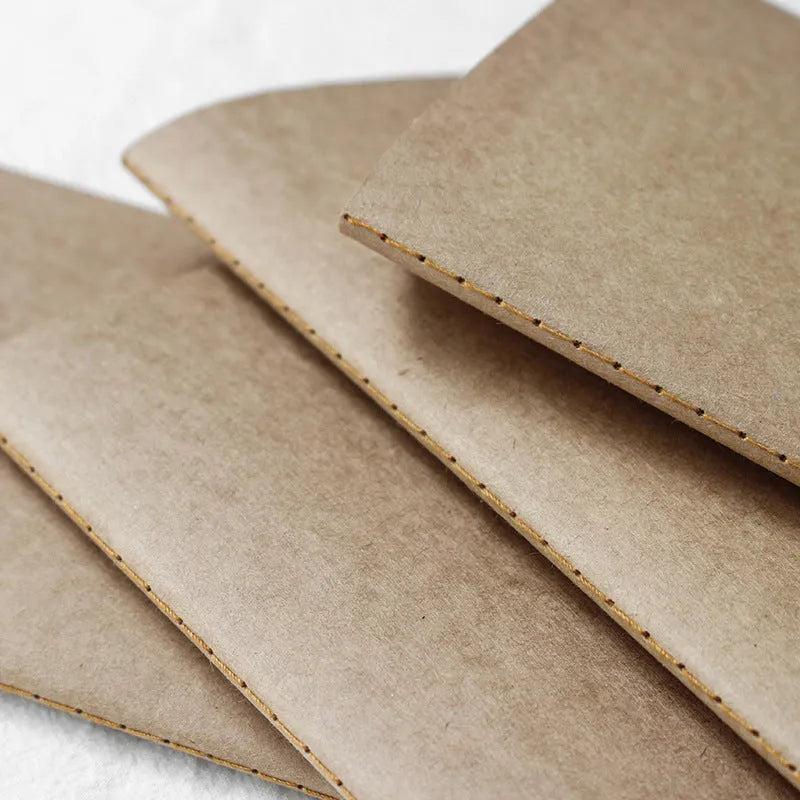 11x21cm cowhide diary refill notebook with saddle stitch binding and ivory white paper pages.