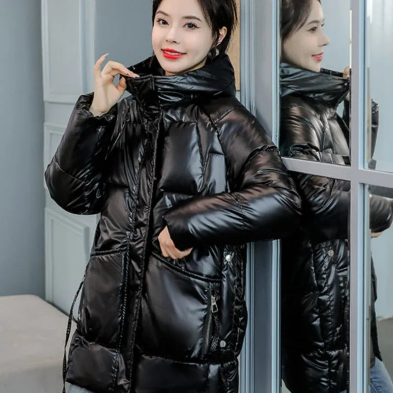 A woman's loose-fit hooded winter jacket in a thick fabric, shown in a choice of colours.