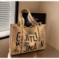 Large canvas women's travel tote bag with shoulder strap and printed design