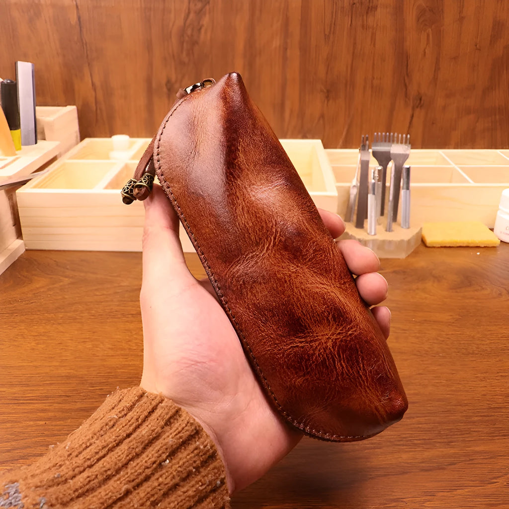 Leather glasses buggy bag in first layer cowhide with belt clip, shown in black, burgundy, brown or light brown.