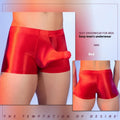 Men's red boxer shorts with a black elephant nose novelty print, showing mid-waist and seamless design.