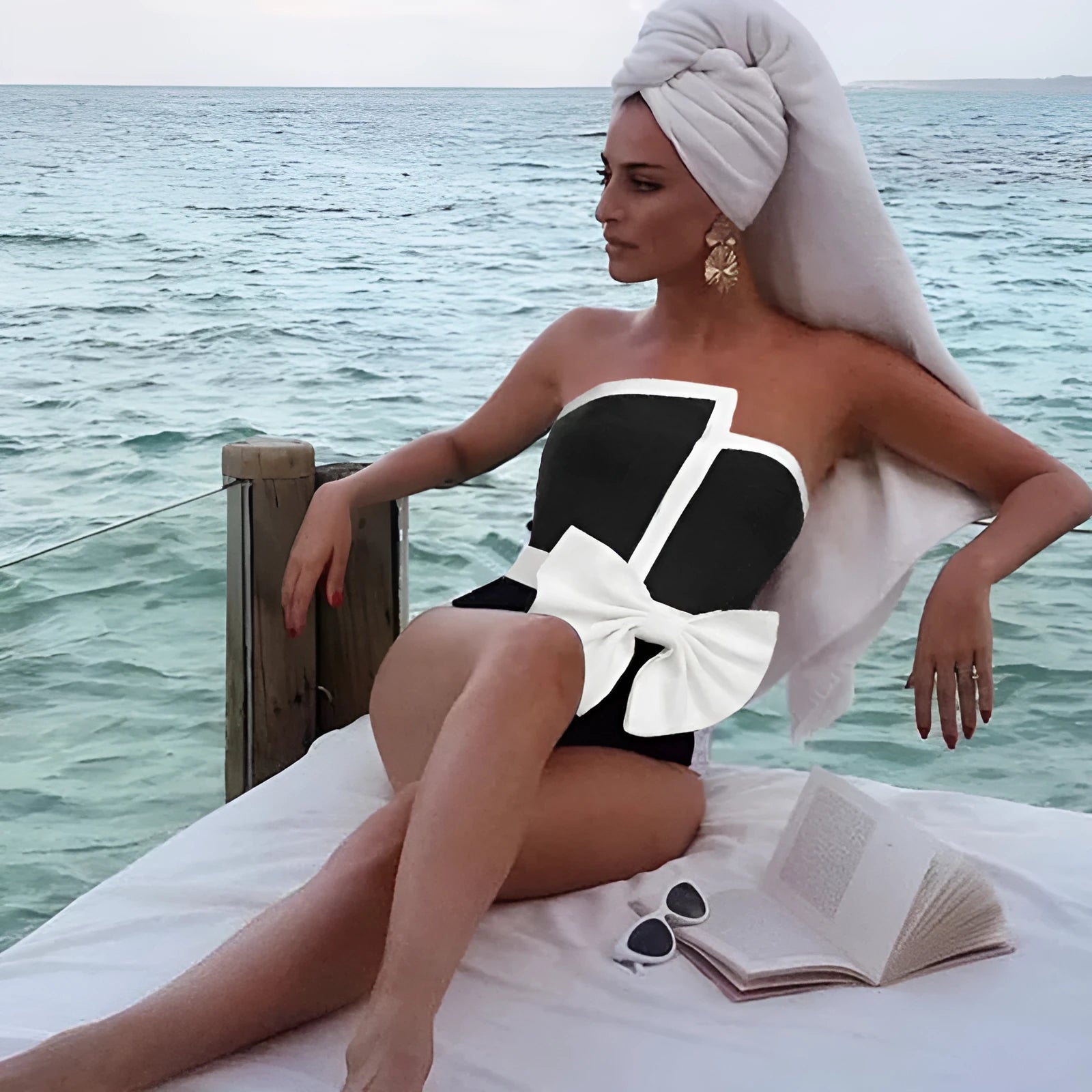 Women's black and white colour-block one-piece swimsuit with bow detail and tube top neckline