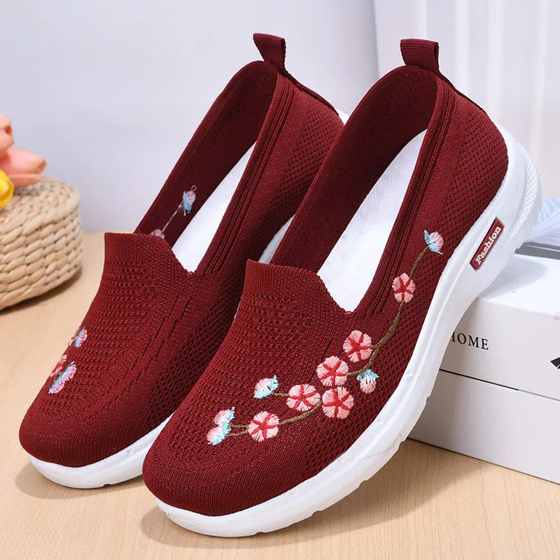 Women's wine red embroidered floral woven pumps with a flat anti-slip sole.