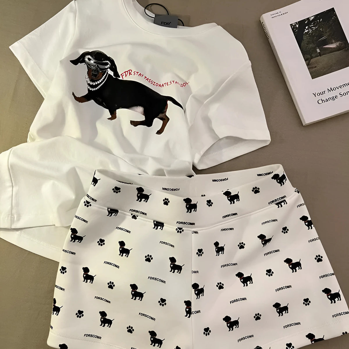 Sausage dog print short sleeve pajama set includes top and shorts in graphic-coloured suit