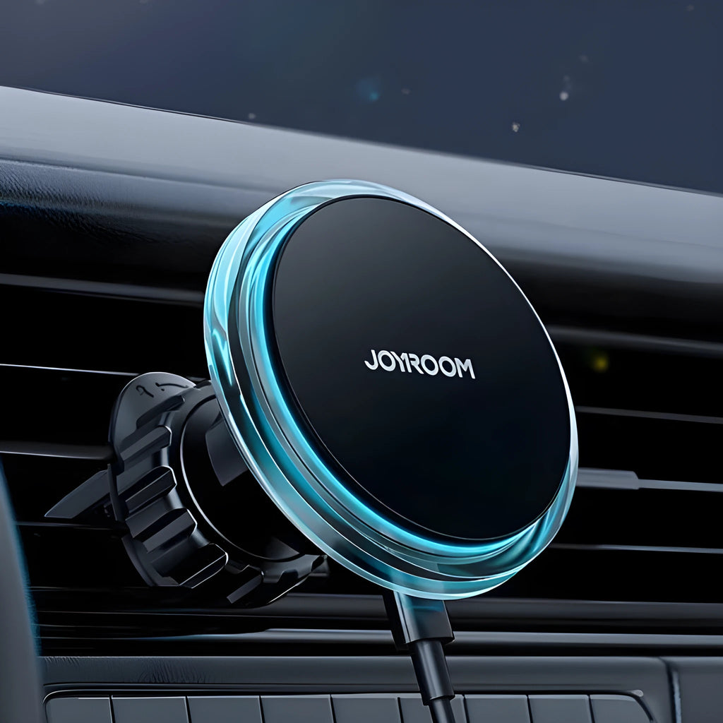 Black magnetic wireless car phone charger mounted on vehicle air vent