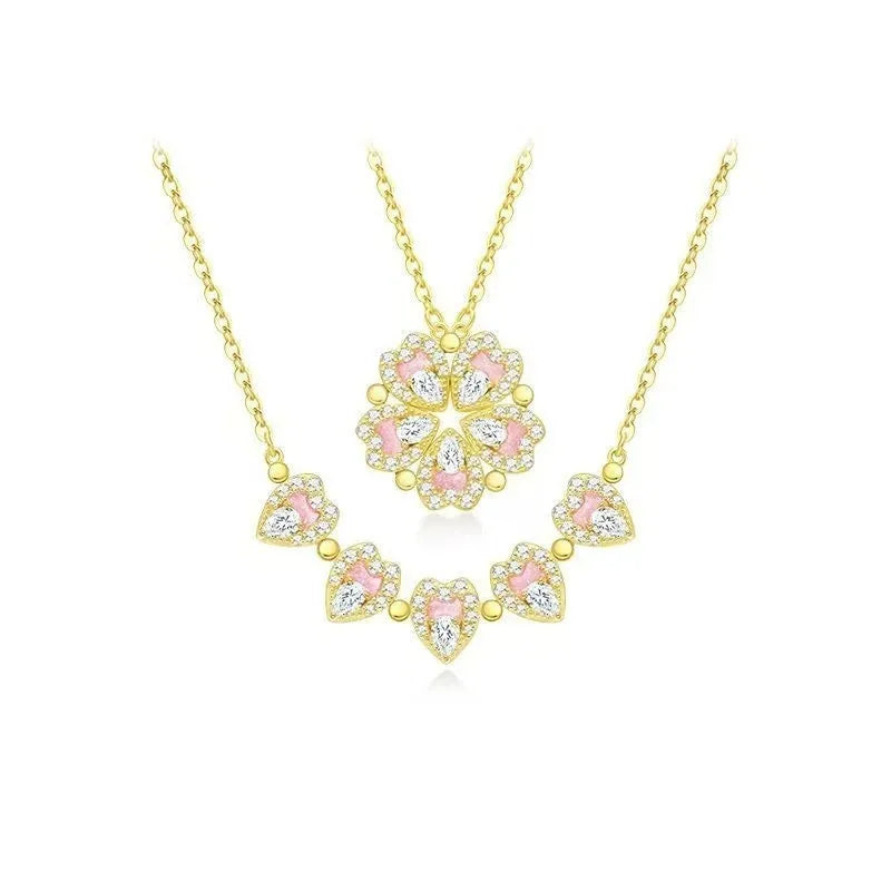 Dual-wear summer mori necklace with copper heart pendant and flower elements in gold colour on woman