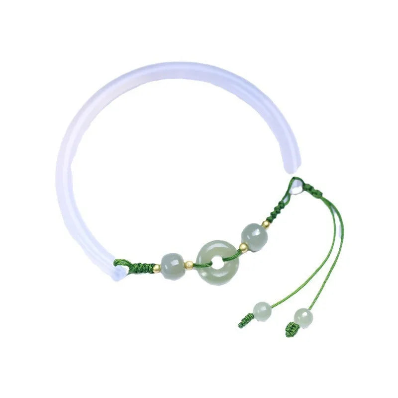 Hand-woven white agate bracelet with hetian jade accents and traditional peace buckle on wrist