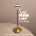 Metallic gold UFO-shaped rechargeable table lamp with touch-sensitive dimming controls.
