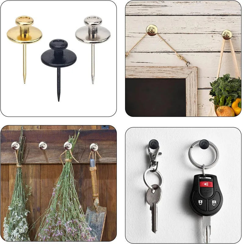 Fancy thumb tack set in mixed colours black gold silver bronze on a corkboard surface