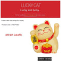 Solar powered plastic Maneki Neko waving cat decoration in yellow for car dashboard