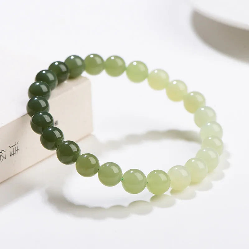 Natural clear water Hetian jade bracelet with gradient colour beads on wrist