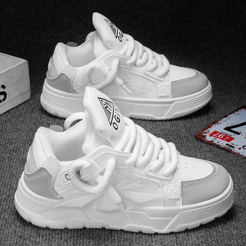 Men's white chunky sneakers with a cartoon pattern, round toe, and thick rubber sole on a plain background.