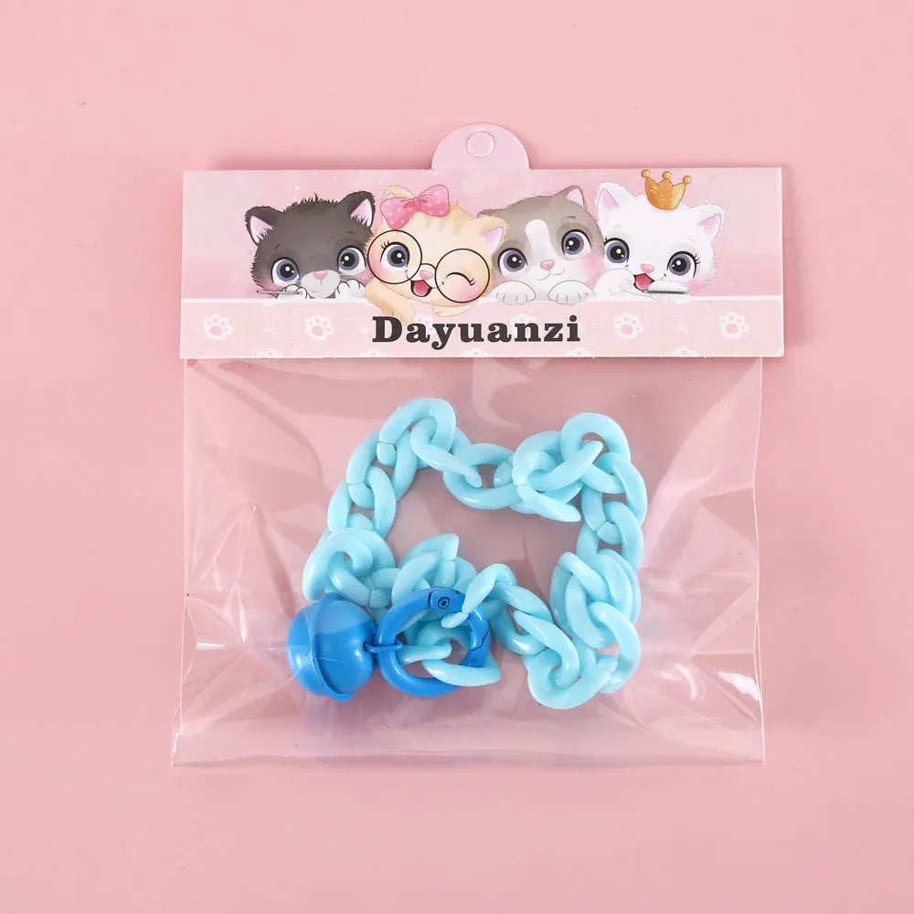 A macaron candy coloured plastic pet collar with chain detailing, shown in blue, pink, and mixed colour options.