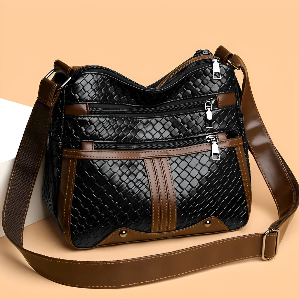 Brown PU leather single shoulder messenger bag with woven strap and multiple compartments.