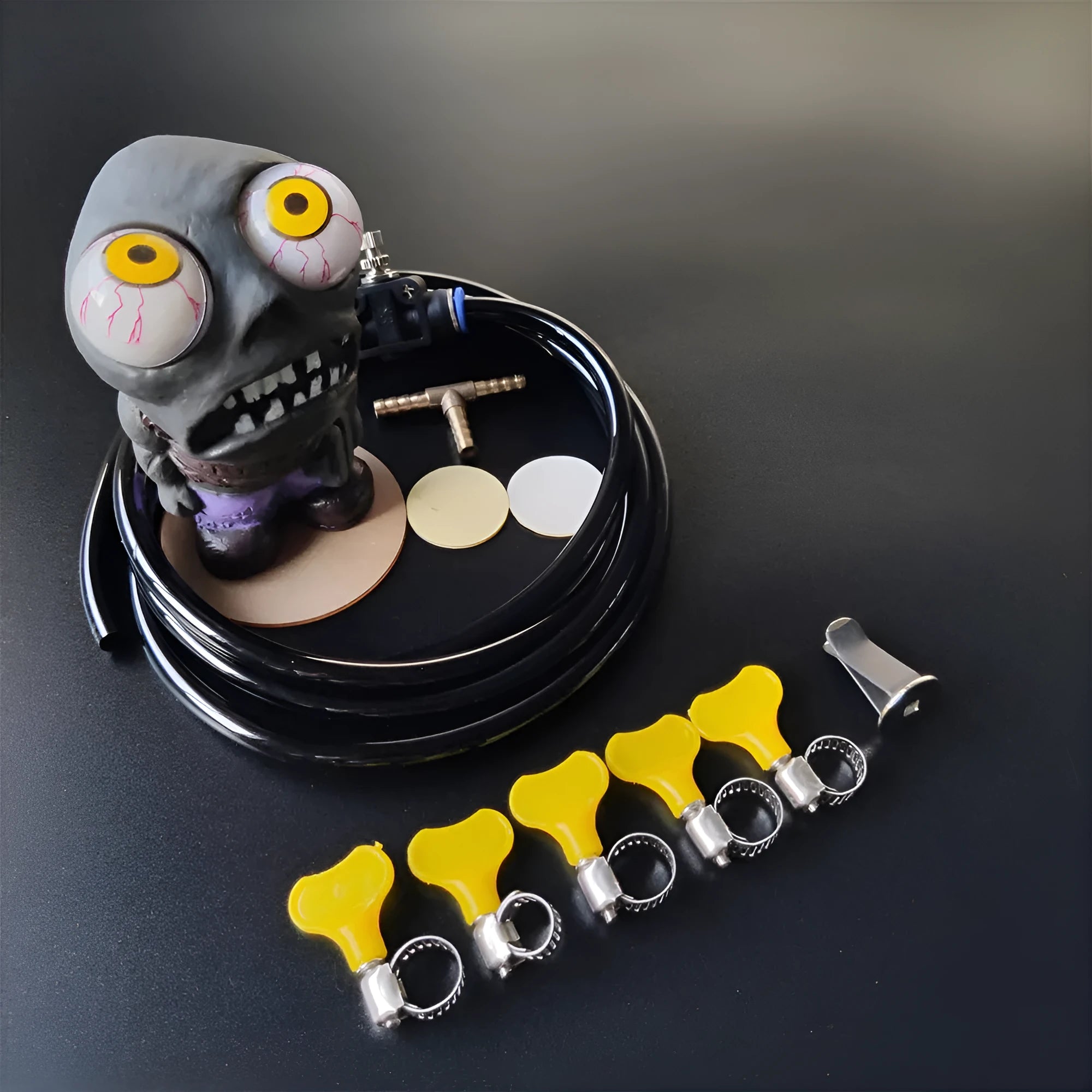Turbo car blow-off valve accessory kit with rubber doll, copper tube, and pressure valve.