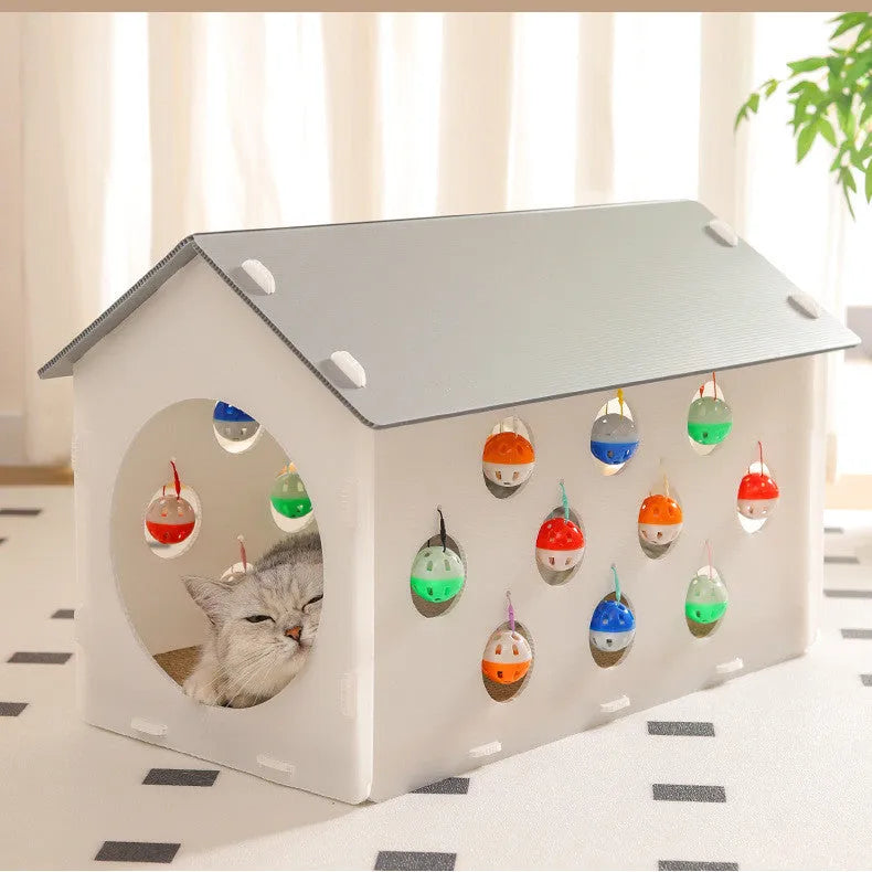 Plastic integrated cat scratch board, nest bed, and tunnel toy with a bell.