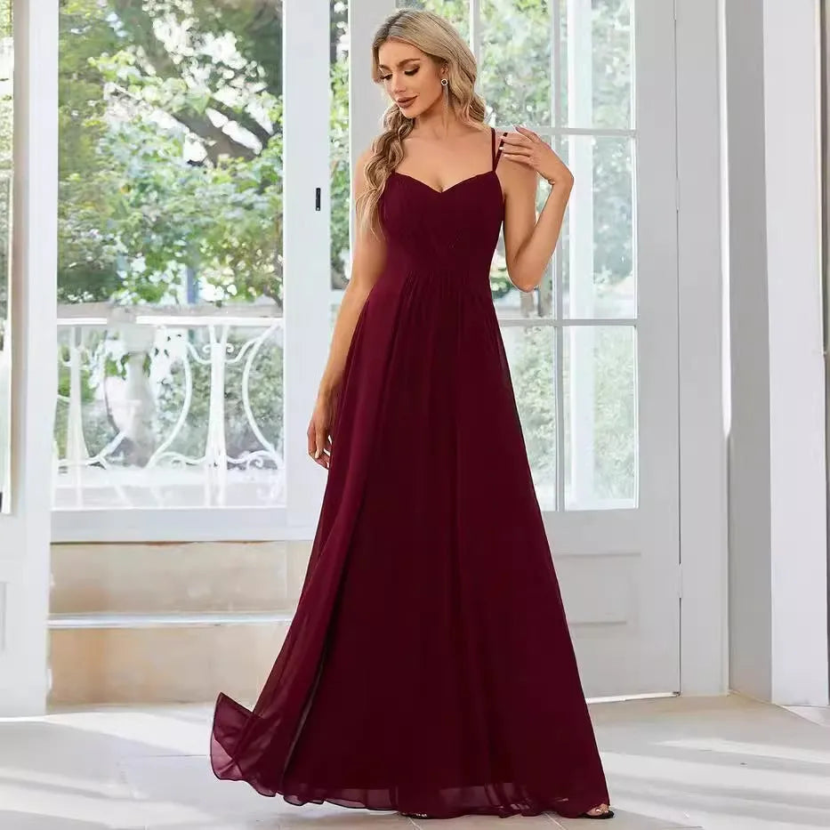 Women's sleeveless A-line long dress with pleated skirt detail in solid colour