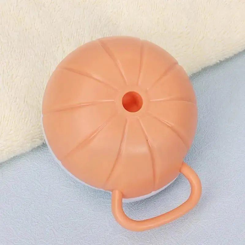 Orange TPR dog bath brush with shampoo dispenser, massage bristles and comb teeth.