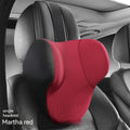 Black memory foam car headrest pillow and lumbar support pillow on a car seat