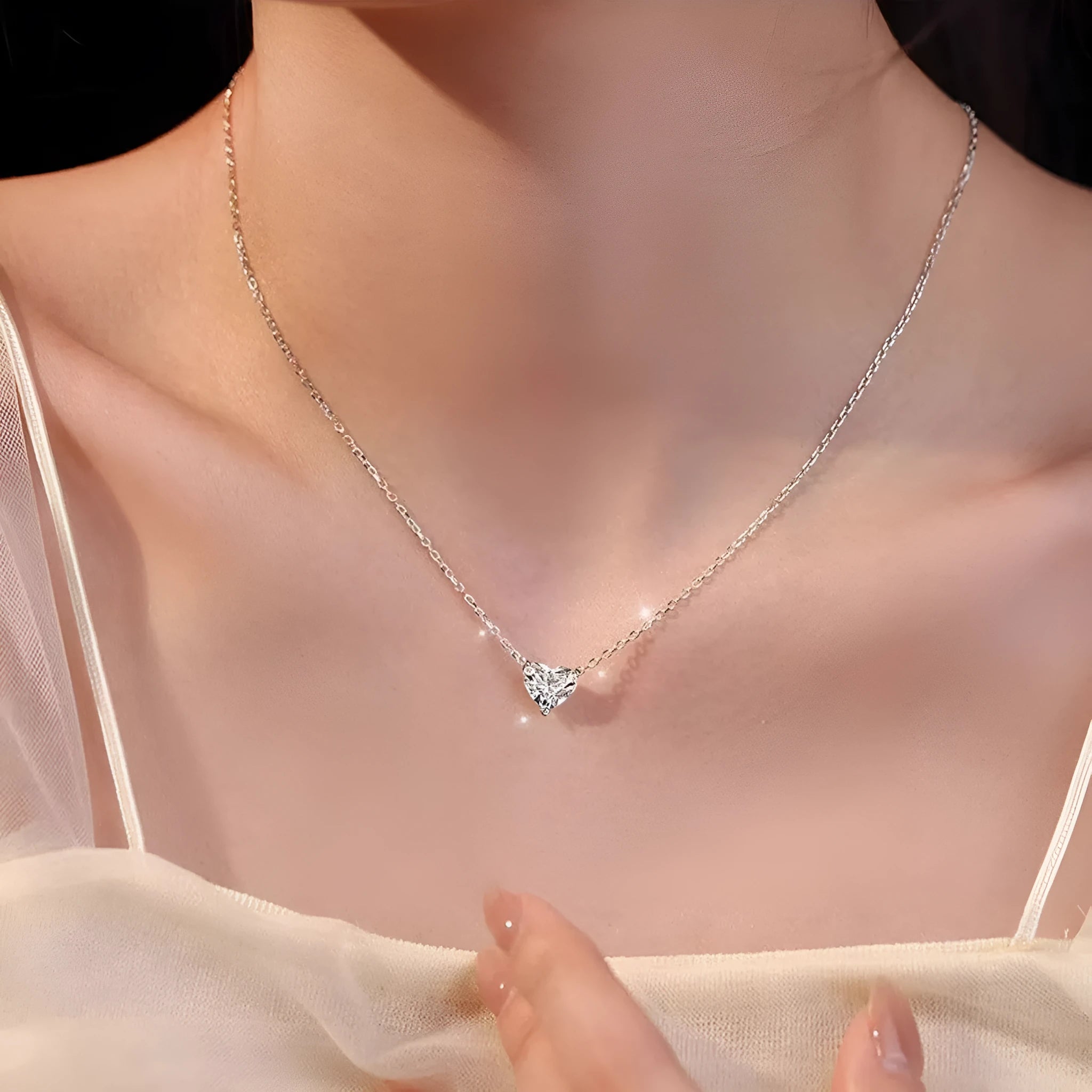 Women's silver-toned copper necklace with simple heart pendant on fine chain