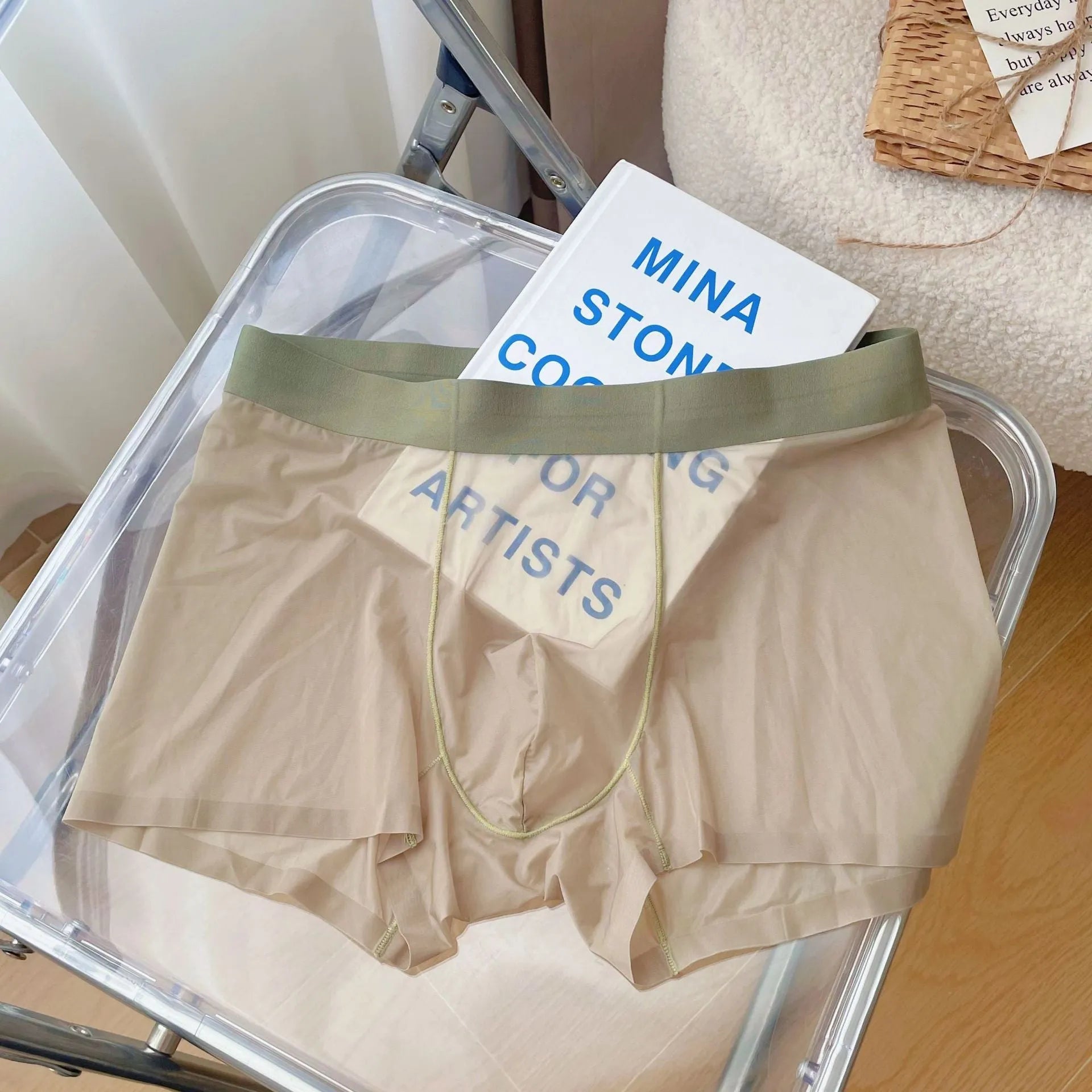 Men's thin breathable seamless boxer shorts in light brown colour on a grey background