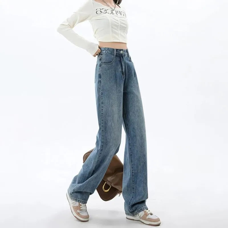 Retro blue women's wide leg jeans with a high waist and straight leg on a hanger