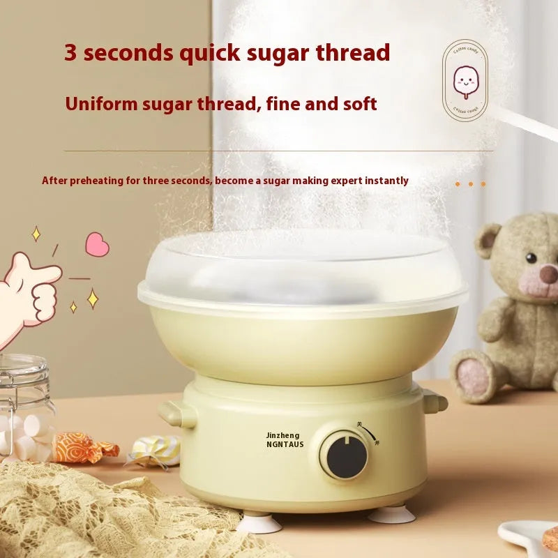 Mini cotton candy machine in blue with metal body and round heating tube on a countertop