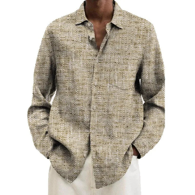Man wearing a multi-colour patterned, long-sleeve cardigan-style shirt for casual leisure.