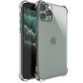 Clear shockproof TPU phone case for various iPhone models on a table.