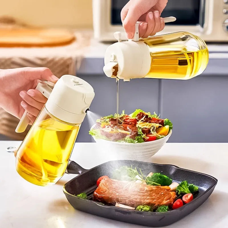 Glass olive oil sprayer bottle with ergonomic handle in beige, showing spray and pour functions.