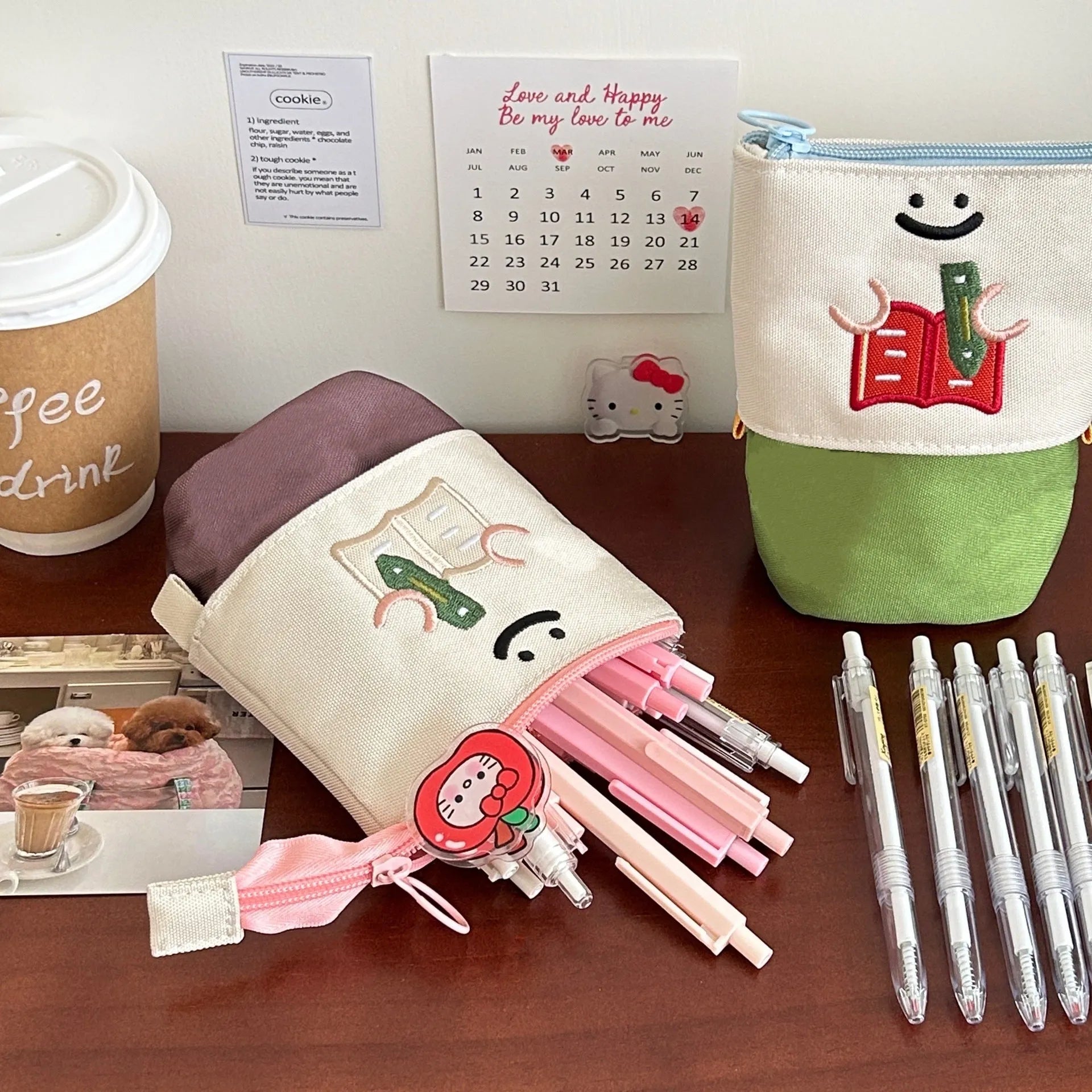 Brown collapsible cartoon design pencil case made from Oxford fabric, shown with zip open.