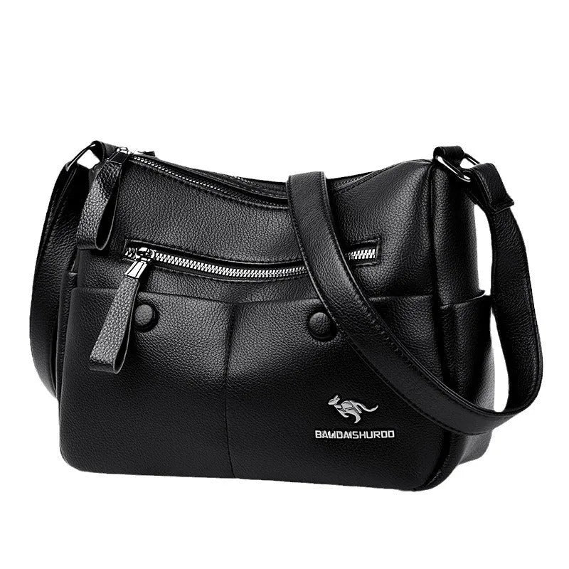 Soft PU leather crossbody shoulder bag in horizontal square shape with stitching details and multiple compartments