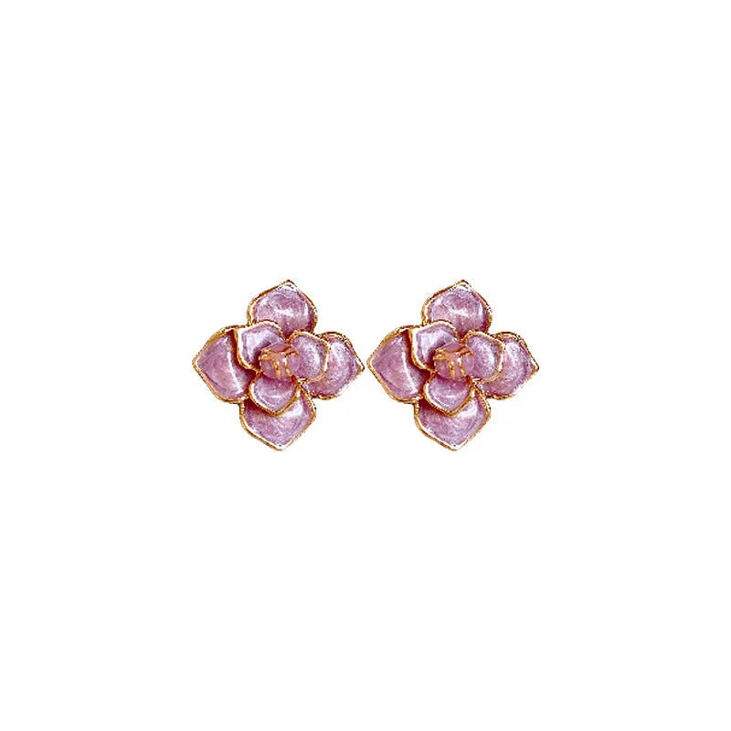 Gold plated purple oil-spot glaze flower stud earrings on a copper base.