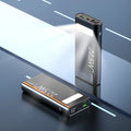 Black alloy power bank with LCD display showing battery level, featuring USB-A and USB-C ports.