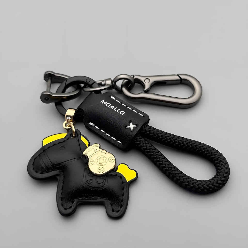 Handmade brown cowhide leather keychain with a zinc alloy pony belt buckle on a green flanelle rope.